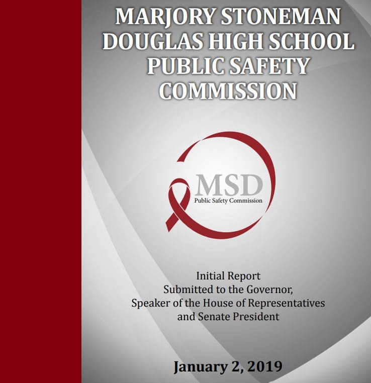 A red ribbon is on the cover of this report.