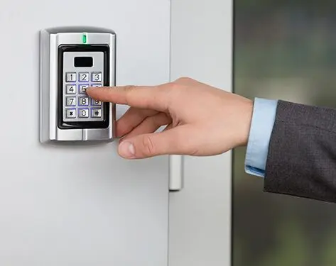 A person is using the electronic key to open a door.
